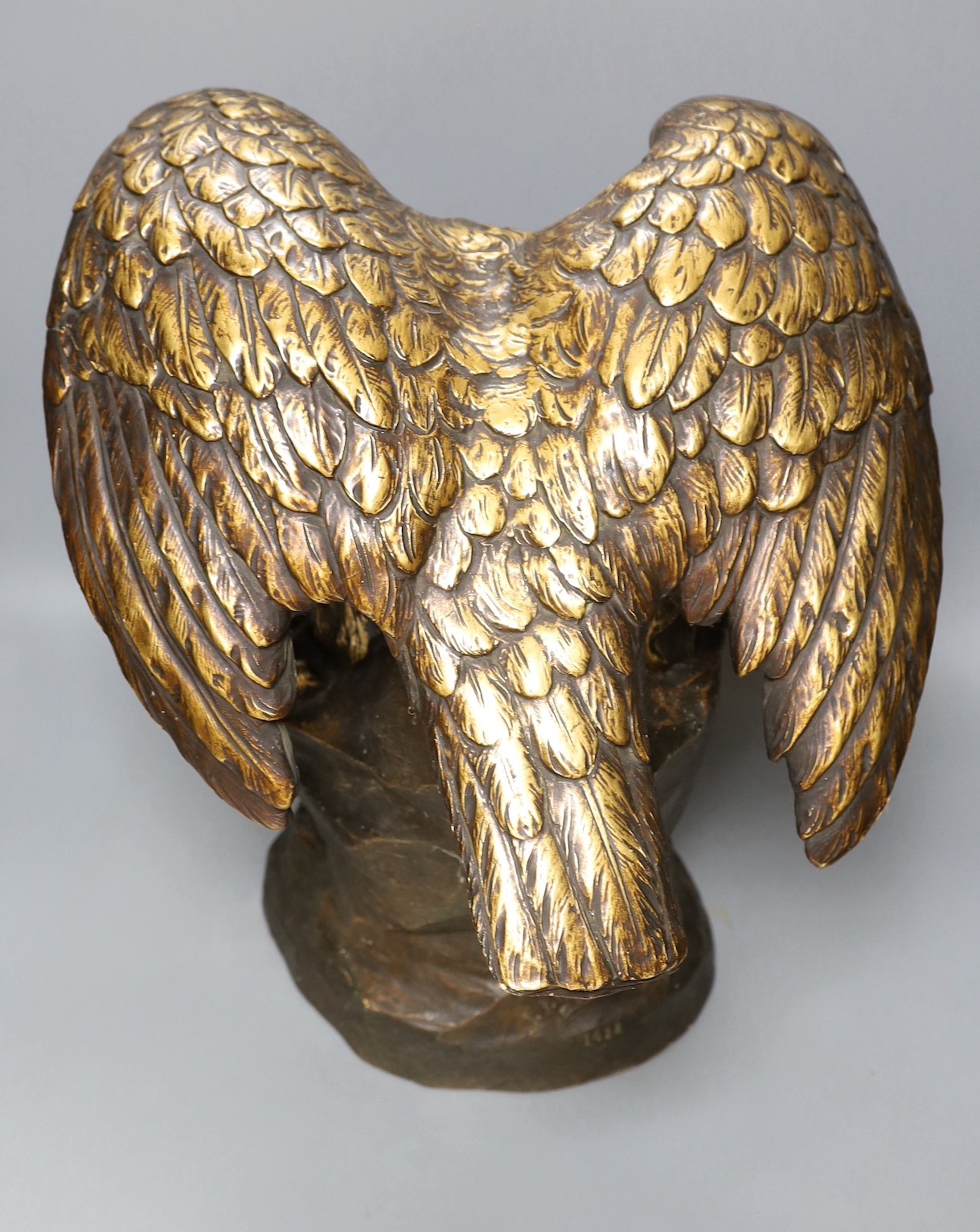 After G V Vaerenbergh, an Austrian large gilded and cold painted ceramic perched eagle - 46cm tall